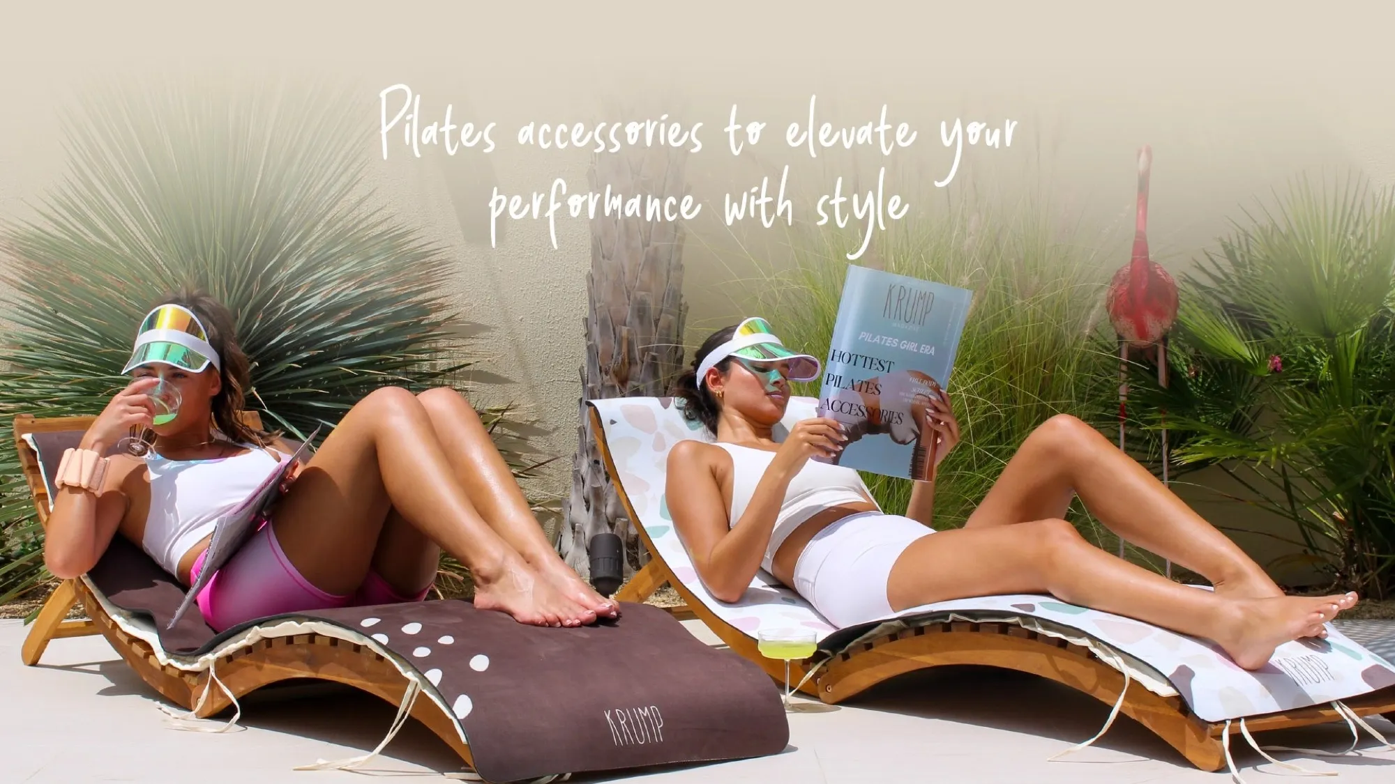 Two women on loungers with KRUMP mats outdoors