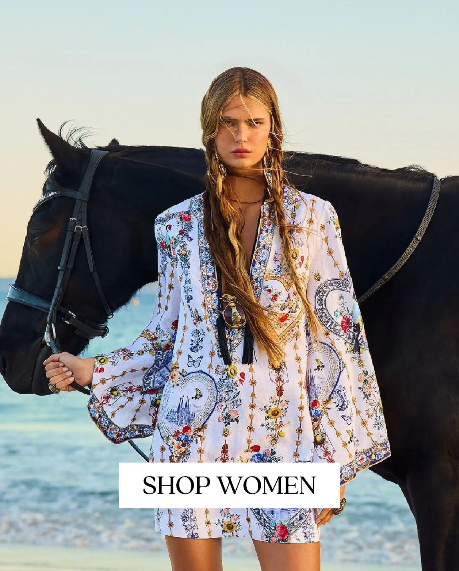 Printed kaftan, model beside a horse on the beach